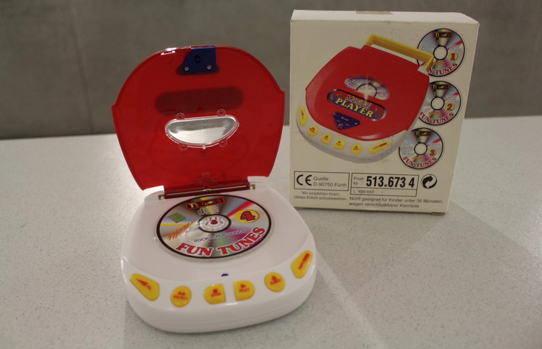 Aufgeklappter Musical Player mit eingelegter CD sowie die Aufbewahrungsbox des &quot;Musical Players&quot;